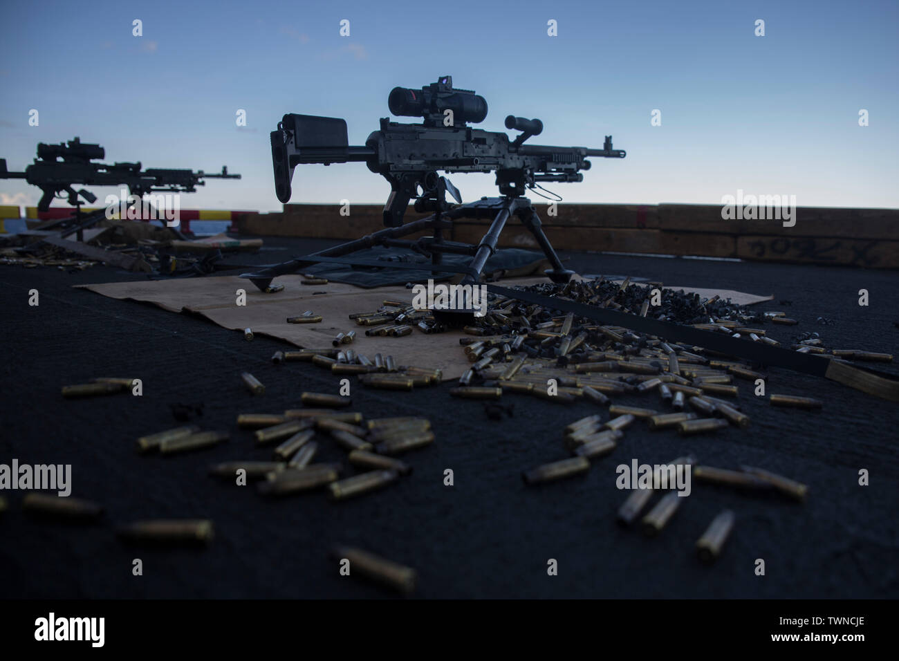 M240B medium machine guns stand by aboard the amphibious assault ship USS Wasp (LHD 1), underway in the Coral Sea, June 15, 2019. The 31st Marine Expeditionary Unit, the Marine Corps` only continuously forward-deployed MEU, provides a flexible and lethal force ready to perform a wide range of military operations as the premier crisis response force in the Indo-Pacific region. (Official U.S. Marine Corps photo by Lance Cpl. Kenny Nunez Bigay) Stock Photo